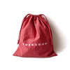 TUCKSHOPのGIFT BAG、コットン製の赤い巾着バッグ、ドローストリング仕様。