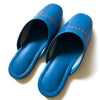 Blue faux leather indoor slippers with logo print, featuring a comfortable design and a sleek finish.