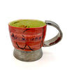 Handcrafted PLATINUM MUG featuring vibrant red and green colors with embossed logo and platinum coating.