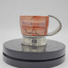 Unique PLATINUM MUG by artist Eri Azuma, featuring a textured design and embossed logo, showcasing a vibrant, artistic style.